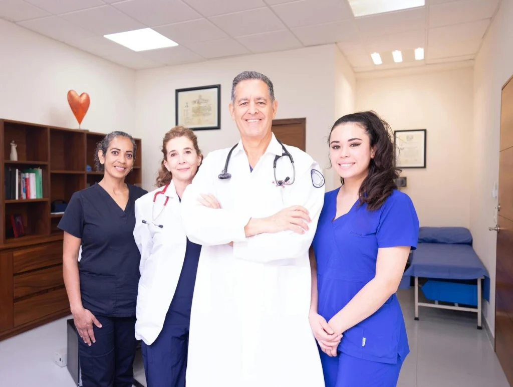 Doctor and nurses smiling at Seva Medical Clinic