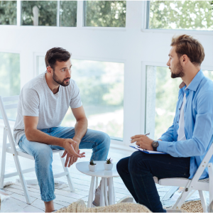 Therapist helping a patient with behavioural and emotional challenges through counselling