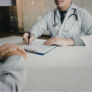 Male patient receiving chronic condition management guidance from doctor