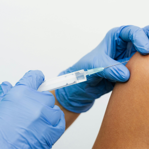 Patient receiving a non-surgical injection for pain management from a healthcare professional