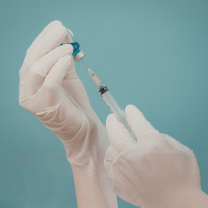 Doctor preparing PRP regenerative therapy for a patient to treat joint or muscle pain